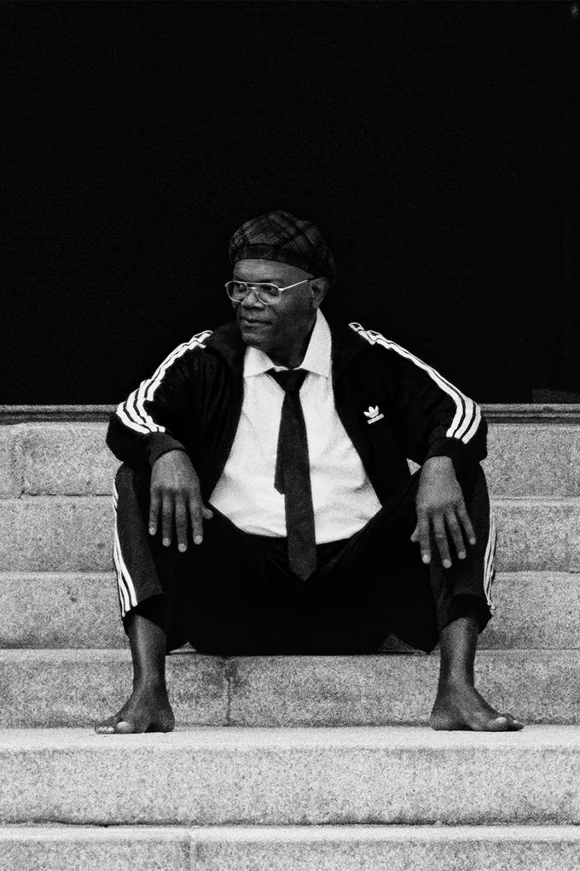 Samuel L Jackson walking through the endless corridors of a surreal hotel alongside Kendall Jenner wearing a red jacket and Tyshawn Jones wearing denim shorts.