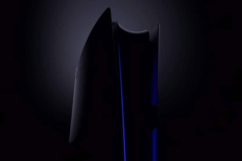 A standard PlayStation 5 and PS5 Pro console cloaked in black.