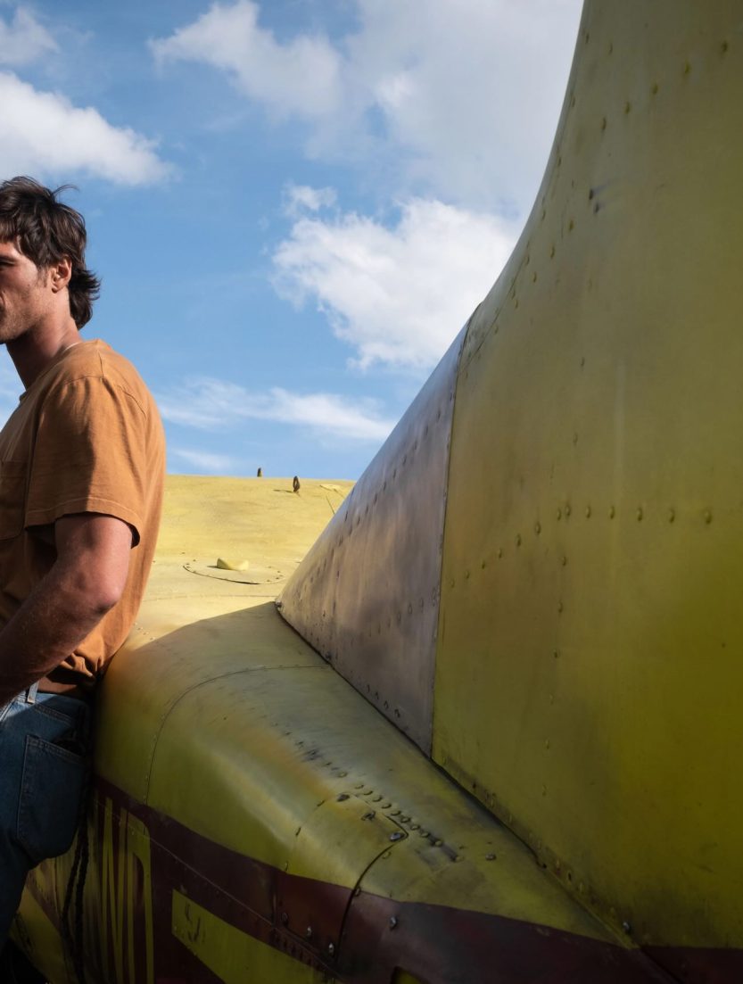 Jacob Elordi as Hig standing in a desolate post-apocalyptic Colorado landscape in Ridley Scott's The Dog Stars.